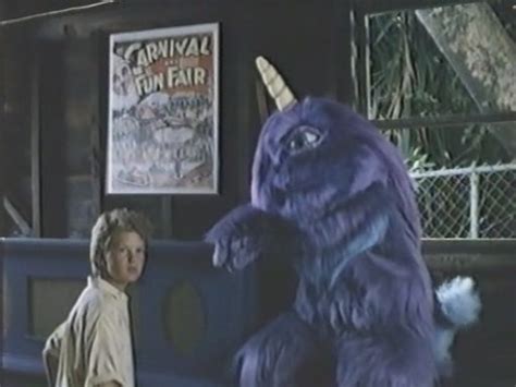 The huge booger purple people eater comes across the witch doctor